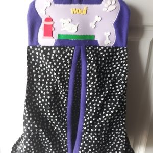 Handmade bag to hold dogs toys on door handle.